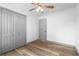 Bedroom with wood-look floors, closet, and neutral paint, ready for your personal touch at 510 Apollo Ave, Deltona, FL 32725