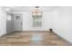 The dining area has wood floors, a stylish light fixture, and neutral decor at 510 Apollo Ave, Deltona, FL 32725