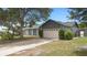 This beautifully landscaped property showcases a spacious driveway and a well-maintained two-car garage at 510 Apollo Ave, Deltona, FL 32725