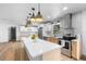 Modern kitchen boasting stainless steel appliances, custom cabinetry, quartz countertops, and ample storage space at 510 Apollo Ave, Deltona, FL 32725