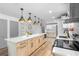 This open kitchen features custom cabinets, a large center island, and stainless steel appliances, perfect for entertaining at 510 Apollo Ave, Deltona, FL 32725