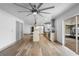 Bright eat-in kitchen featuring stainless steel appliances, pendant lighting, and wood-look flooring at 510 Apollo Ave, Deltona, FL 32725
