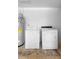 Laundry area with washer, dryer, and water heater in a clean space at 510 Apollo Ave, Deltona, FL 32725
