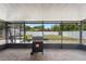 A covered patio with a BBQ grill and a view of the backyard at 510 Apollo Ave, Deltona, FL 32725