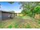 Spacious backyard featuring a new wooden fence and well-maintained lawn, perfect for outdoor activities at 5204 Van Aken Dr, Orlando, FL 32808