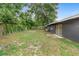 Expansive backyard enclosed by a wooden fence, providing privacy and plenty of room for outdoor enjoyment at 5204 Van Aken Dr, Orlando, FL 32808