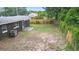Large, private backyard featuring a sturdy wooden fence and ample space for recreation and landscaping at 5204 Van Aken Dr, Orlando, FL 32808