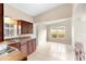 This bright kitchen features stainless steel sink, lots of cabinet space and a breakfast nook overlooking the yard at 5204 Van Aken Dr, Orlando, FL 32808