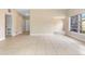 Spacious living room with tile floors, neutral paint, and natural light at 5204 Van Aken Dr, Orlando, FL 32808