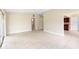 Open-concept living area featuring tile flooring, neutral walls, and lots of space to make your own at 5204 Van Aken Dr, Orlando, FL 32808