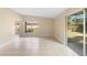 The sun-filled living area features large windows, sliding glass door and tile floor at 5204 Van Aken Dr, Orlando, FL 32808