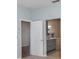 Bathroom features a double sink vanity with gray cabinets and a tub with tile surround at 5445 Turton Ln, Port Orange, FL 32127