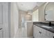 Bright bathroom featuring dual sinks, granite counters and tile flooring at 570 Cypress Ave, Orange City, FL 32763