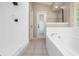 Bright bathroom featuring a garden tub and separate shower at 570 Cypress Ave, Orange City, FL 32763