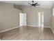 Large primary bedroom with vaulted ceiling, ceiling fan, and an en-suite bathroom at 570 Cypress Ave, Orange City, FL 32763