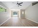 Bedroom featuring durable floors, large windows, and a ceiling fan at 570 Cypress Ave, Orange City, FL 32763