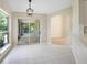 Bright dining area with sliding glass doors to screened porch and neutral tile flooring at 570 Cypress Ave, Orange City, FL 32763