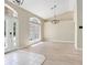 Bright living room with high ceilings, decorative light fixtures, and hardwood flooring at 570 Cypress Ave, Orange City, FL 32763