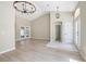 Spacious living room featuring hardwood flooring, high ceilings, and a neutral color palette at 570 Cypress Ave, Orange City, FL 32763