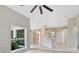 Open-concept living space featuring neutral color palette, hardwood floors and natural lighting at 570 Cypress Ave, Orange City, FL 32763