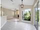Open-concept space with tile flooring, a sliding glass door, and a view into the living room at 570 Cypress Ave, Orange City, FL 32763