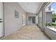 Enclosed back patio with lots of natural light and access to the house at 570 Cypress Ave, Orange City, FL 32763