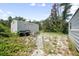 The backyard features a metal shed, perfect for storing tools and equipment at 570 Cypress Ave, Orange City, FL 32763