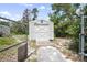 Storage shed sits behind the house, with a double door and metal roof at 570 Cypress Ave, Orange City, FL 32763