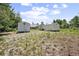 The home's expansive backyard offers ample space for outdoor activities and recreation at 570 Cypress Ave, Orange City, FL 32763