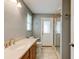This bathroom features a large mirror, tile floors, and a shower at 65 Sycamore Cir, Ormond Beach, FL 32174