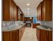 Spacious kitchen with beautiful cherry cabinets, countertops and recessed lighting at 65 Sycamore Cir, Ormond Beach, FL 32174