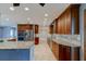 Spacious kitchen featuring granite countertops, stainless steel appliances, and ample custom wood cabinetry at 65 Sycamore Cir, Ormond Beach, FL 32174