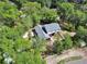 Beautiful aerial view of home surrounded by lush trees and brick patio at 658 Westchester Dr, Deland, FL 32724