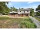 Large backyard featuring a screened porch at 658 Westchester Dr, Deland, FL 32724