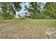 Expansive backyard with lush green grass and mature trees at 658 Westchester Dr, Deland, FL 32724