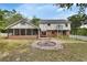 This backyard features a screened porch and patio area at 658 Westchester Dr, Deland, FL 32724