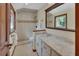 Well-lit bathroom features tiled shower, granite countertop, and natural light at 658 Westchester Dr, Deland, FL 32724