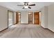 Large bedroom offers soft carpet, natural light, and multiple doorway access to closets at 658 Westchester Dr, Deland, FL 32724