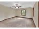 Spacious bedroom with plush carpet, two large windows, and neutral paint at 658 Westchester Dr, Deland, FL 32724