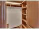 Walk-in closet with built-in shelving and interior lighting at 658 Westchester Dr, Deland, FL 32724