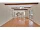 Open-concept dining area with hardwood floors, leading to a modern kitchen and outdoor access at 658 Westchester Dr, Deland, FL 32724