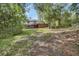 Two-story home surrounded by lush greenery in a serene setting at 658 Westchester Dr, Deland, FL 32724