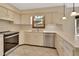 Bright kitchen featuring a stainless-steel dishwasher and oven, white countertops, and tile flooring at 658 Westchester Dr, Deland, FL 32724