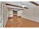 Light-filled living room showcases hardwood floors, a brick fireplace, and built-in shelves at 658 Westchester Dr, Deland, FL 32724