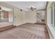 Large living room leading to a dining room and stairs at 658 Westchester Dr, Deland, FL 32724