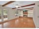 Bright living room boasts hardwood floors, a brick fireplace, and built-in shelves for ample storage at 658 Westchester Dr, Deland, FL 32724