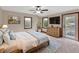Comfortable main bedroom with natural light, carpet, and private outdoor access at 658 Westchester Dr, Deland, FL 32724