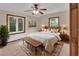 Bright main bedroom featuring two windows and a cozy seating area at 658 Westchester Dr, Deland, FL 32724