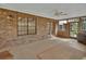 Relaxing porch with a ceiling fan and a brick accent wall at 658 Westchester Dr, Deland, FL 32724