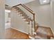 Stairway with carpeted steps, white railings, and wood trim at 658 Westchester Dr, Deland, FL 32724